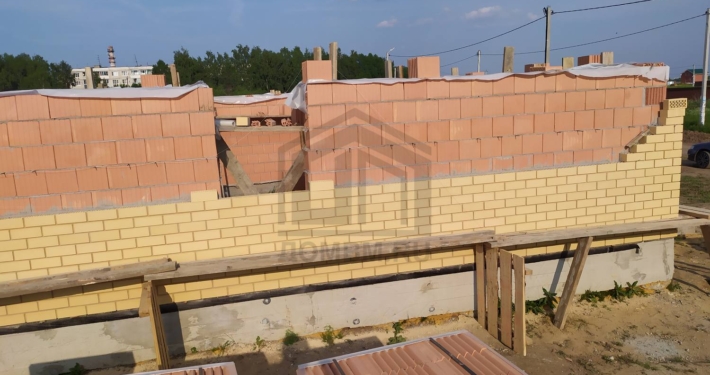 Облицовка стен кирпичом дома с облицовкой кирпичом в Чехове